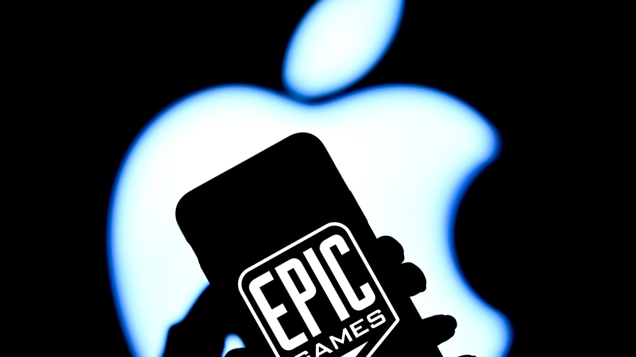Epic Games logo on iPhone with Apple logo in the background