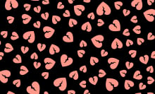 Pink hearts on a black background