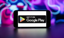 Google play store logo is seen displayed on a mobile phone screen.