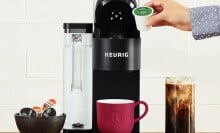 Keurig K-Supreme Single-Serve coffee maker pictured with a bowl of K-Cups and an iced coffee