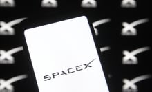 A Spacex logo is seen on a smartphone.