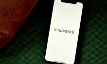 The Substack logo on a smartphone.