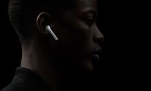 Side profile of a man wearing Apple AirPods 