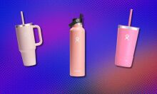 thee pink hydroflask bottles on a purple background