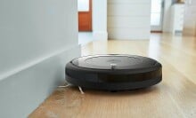 The iRobot Roomba 694 robot vacuum sweeping up pet hair
