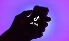 In this photo illustration, a Tik Tok logo seen displayed on a smartphone.
