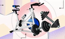 A stationary bike and a dumbbell on a colorful background