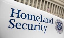The Department of Homeland Security logo is seen on a law enforcement vehicle.