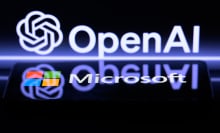 The OpenAI and Microsoft logos reflecting each other on a dark screen.