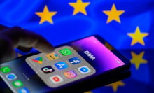 iPhone with apps, EU flag in the background