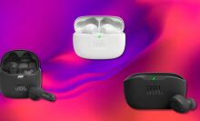 JBL earbuds and charging cases on an abstract background 