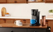 A Keurig is set up in a kitchen 