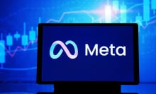 A computer displaying the Meta logo.