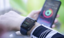 Woman using smart watch and smart phone, Apple watch