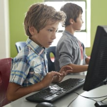 two children at computer