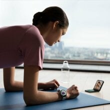 a person doing yoga wears the samsung galaxy watch 6