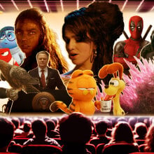 An movie theater with a screen full of characters from upcoming movies. 