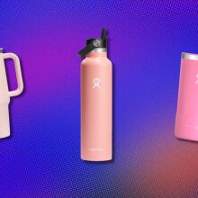 thee pink hydroflask bottles on a purple background