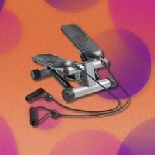 a black and silver mini stepper on a pink and purple background 