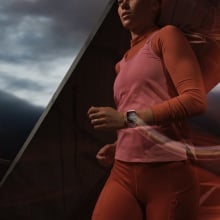 person running while wearing the pink apple watch series 9