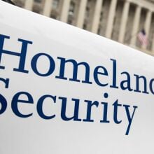 The Department of Homeland Security logo is seen on a law enforcement vehicle.