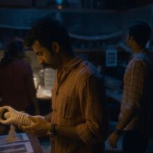 Actor Roshan Mathew holding an object made of ivory in a still from 'Poacher'.