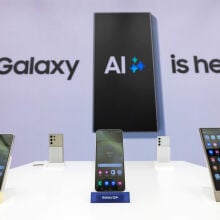 A Samsung store showing Galaxy S24 series with the words "Galaxy AI is here" in the background 