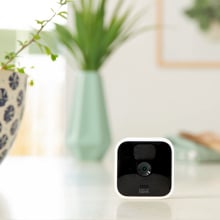 Blink indoor home security camera sits on table 