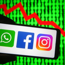 In this photo illustration the Facebook, WhatsApp and Instagram logos are seen on a smartphone.