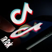 In this photo illustration, the TikTok logo is displayed on a smartphone.