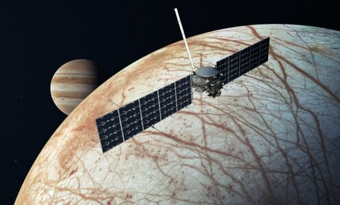 A conception of the Europa Clipper spacecraft flying over Jupiter's moon Europa.
