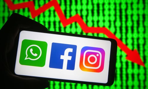 In this photo illustration the Facebook, WhatsApp and Instagram logos are seen on a smartphone.