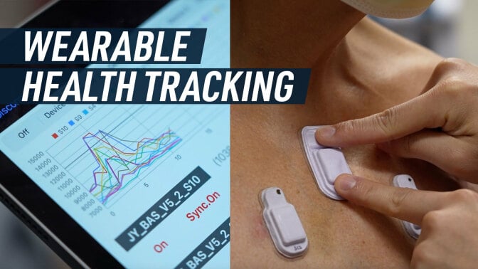 A split screen shows some graphs on a tablet (left), and tiny wearables devices attached to a patient's skin (right). Caption reads: "Wearable health tracking"