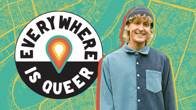 The Everywhere is Queer logo hovers next to a photo of Charlie Sprinkman on top of a green and orange street map. 