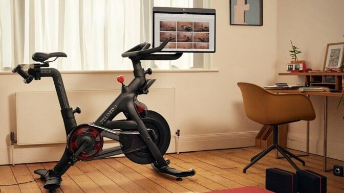 a peloton bike+ sits in a living room