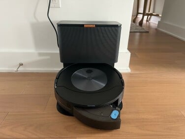 Roomba on charging dock with water tank ejected
