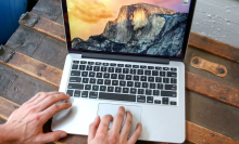 hands typing on refurbished MacBook Pro