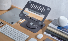 Casa Hub Stand Pro on desktop with keyboard, mouse, and other accessories