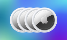 four pack of apple air tags against a blue background