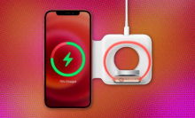 apple's magsafe duo charger charging an iphone and an apple watch against a red and orange abstract background