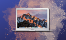 Refurbished MacBook Air on dark background with pink splatter