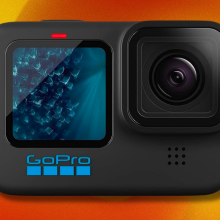 GoPro HERO11 action camera on orange and yellow abstract background