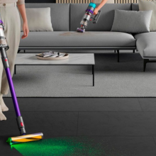 woman vacuuming floors with Dyson Gen5detect Absolute cordless vacuum