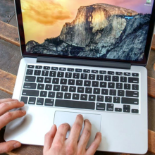 hands typing on refurbished MacBook Pro