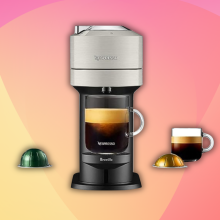 Nespresso machine, coffee mugs and pods