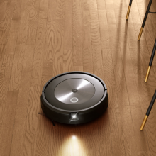 iRobot Roomba j7 with headlight cleaning hardwood floor