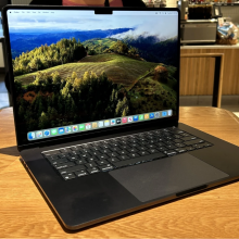 a 15-inch m3 apple macbook air sitting on a wooden table in starbucks