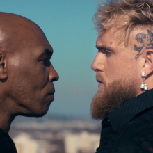 mike tyson and jake paul staring each other down