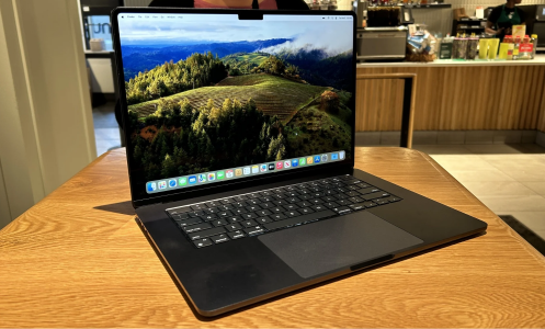 a 15-inch m3 apple macbook air sitting on a wooden table in starbucks