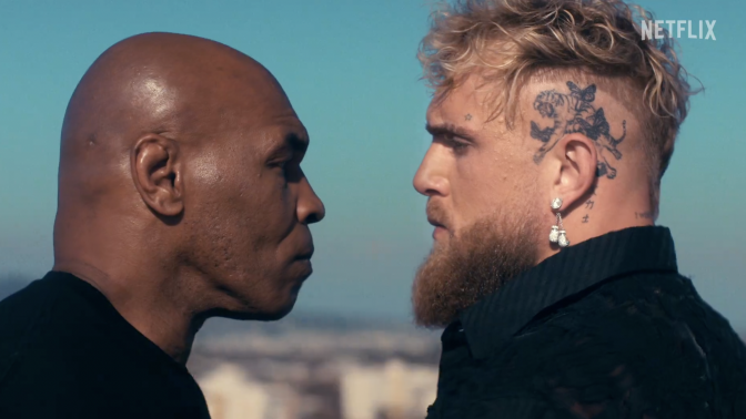 mike tyson and jake paul staring each other down